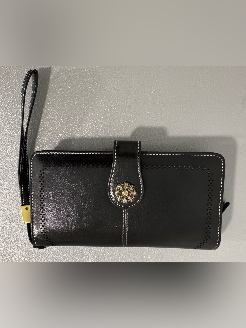 Black Leather Wallet with Decorative Gold Accent